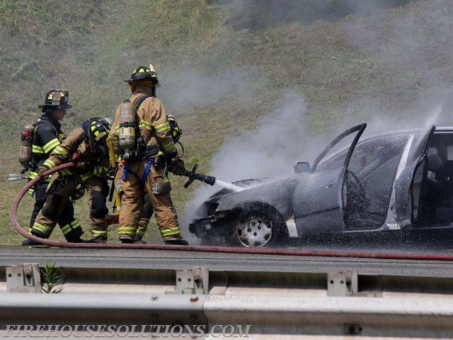 Firefighter Pellegrino Along with purchase members extinguishing a Car Fire in West Harrison's First Due on I287 WB at Exit 7 